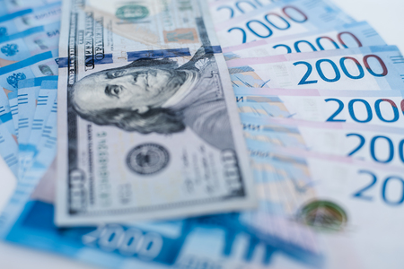 American 100 dollar banknote and 2000 russian roubles. Concept trade, cooperation or wrestlingの写真素材