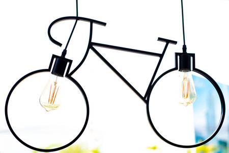 Ceiling lamp. Light fixture made in the shape of a bicycle