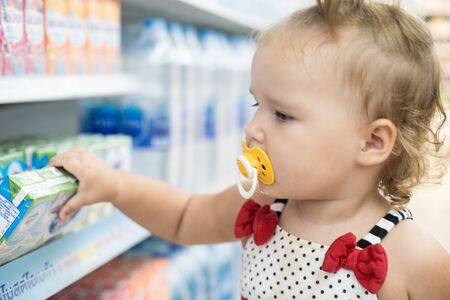 Pattaya, Thailand - May 19, 2019: The child in the store buys food. The child in the supermarket chooses foodのeditorial素材