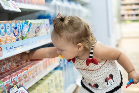 Pattaya, Thailand - May 19, 2019: The child in the store buys food. The child in the supermarket chooses foodのeditorial素材
