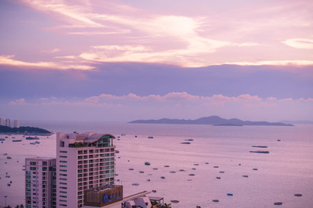 Pattaya, Thailand - April 30, 2019: Landscape of tropical beach with old fishing boat parked on the beach in twilight sunset in Pattaya, Thailand. Landscape of tropical beach with old fishing boatのeditorial素材