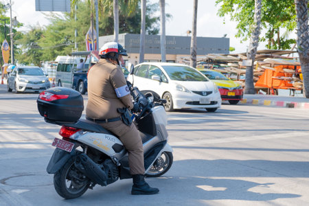 Pattaya, Thailand - May 22, 2019: Police stopped motorcyclists in the street in Pattaya.