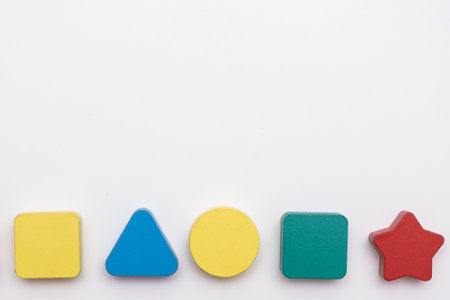 On a white background in a chaotic manner are large multi-colored childrens figures. copy spaceの写真素材