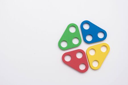 On a white background in a chaotic manner are large multi-colored childrens figures. copy spaceの写真素材