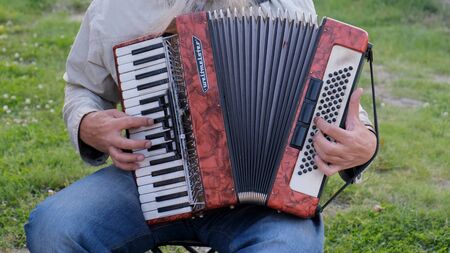 Nizhnevartovsk, Russia - August 25, 2019: street musicians play the button accordion and trumpet.のeditorial素材