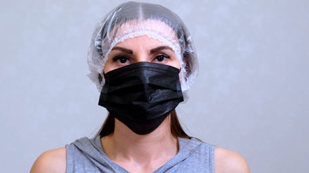 Female patient in black protective mask. Hygiene concept. prevent the spread of germs and bacteria...