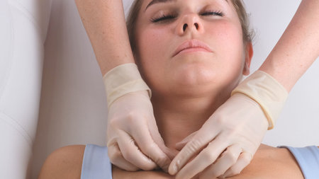 Chin massage of woman young woman during face massage at beauty salon.