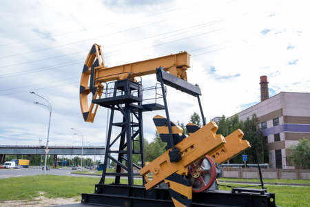 Oil rocking chair in Russia. The concept of oil production, refining and the cost of a barrel of oil.の写真素材