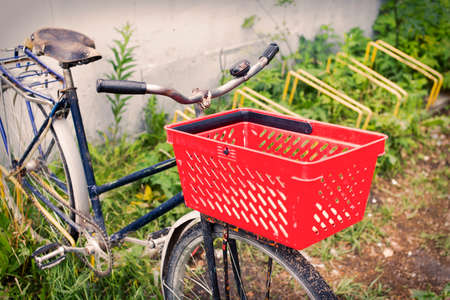 Bicycle with basket. bike in the Parking lot with a basket from the storeの写真素材