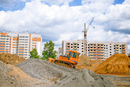 bulldozer on a construction site. a bulldozer and a construction site for the erection of a new houseの写真素材