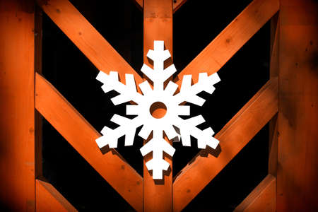 Christmas snowflake. Christmas snowflake made of wood adorns the wallの写真素材