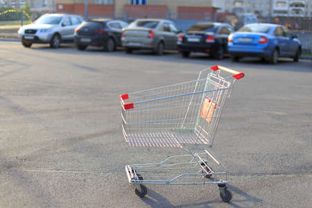 shopping cart. the shopping cart left in the Parking lot of the storeの写真素材