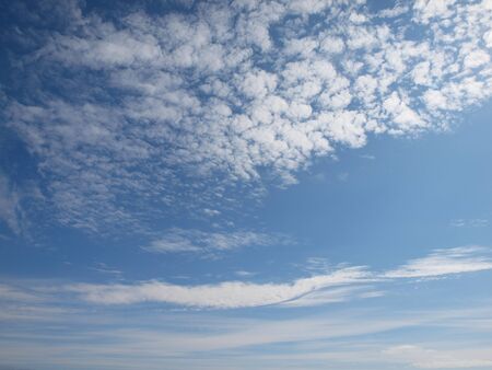 Blue sky with white clouds background. Sunny dayの写真素材
