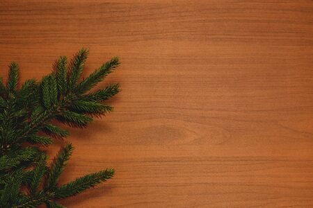Fir brunch on wooden background with place for text. New year decorationの写真素材