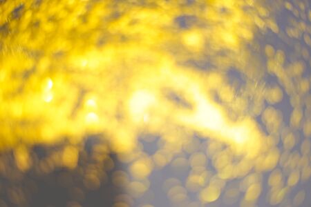 golden glitter sparkle on black background. Flat lay. Christmas background. New year decoration. wallpaper. Copy space. Blurの写真素材