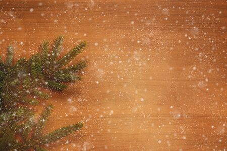 Fir brunch on wooden background with place for text. New year decoration. New year decoration background, flat lay, top view, horizontal, copy spaceの写真素材