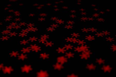 red snowflake glitter sparkle on black background. Isolated. Flat lay. Christmas background. New year decoration. wallpaper. Copy spaceの写真素材