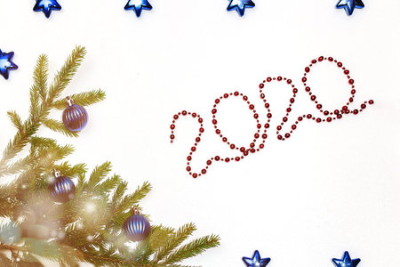 Christmas gift box and holiday decor with fir tree brunch, red balls and gold confetti. New year...