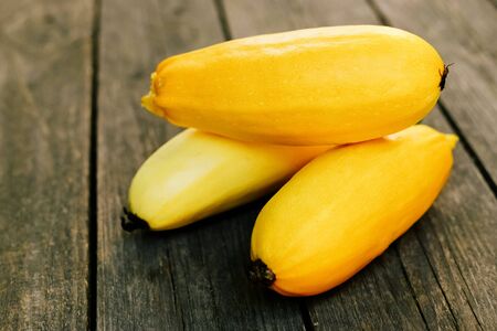 Squash on wooden surface. Seasonal vegetables. Fresh vegetables. Healthy diet.の写真素材