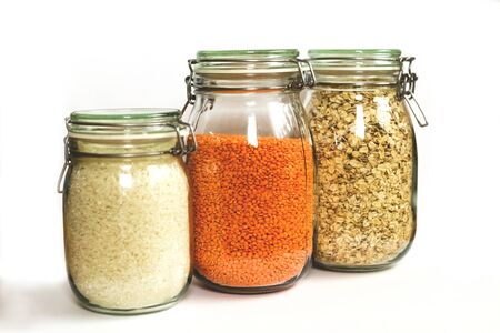 Zero waste. Food products on background table. Plastic free concept. Raw cereals, rice, lentils in glass jar. Eco shopping. Isolateの写真素材
