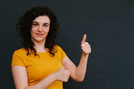 Portrait of funny emotional girl on grey background. Surprise. Upset. Joy. Frightの写真素材