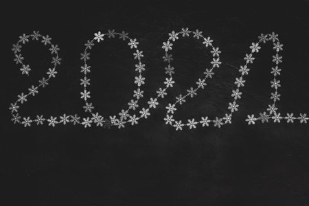 Christmas composition. 2021 from beeds on dark background.の写真素材