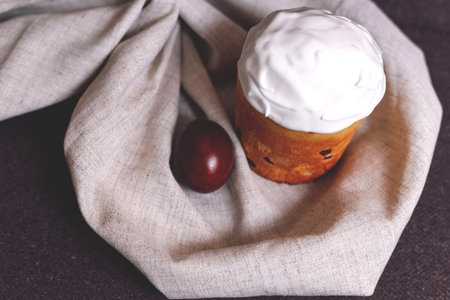 Easter pastries and colored eggs on a textile background. Traditional pastries for Orthodox holidays.の写真素材