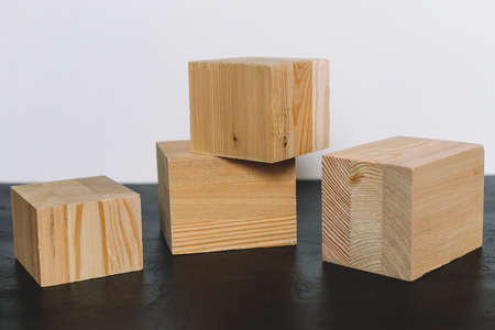 Natural mockup of wooden cubes for cosmetics on black and white background.の写真素材
