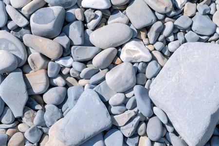 Nature background from grey large sea pebbles stones. Video texture beige, grey, blue big and small...