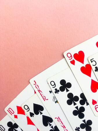 Cards for poker on orange background. Poker play. Place for text.の写真素材