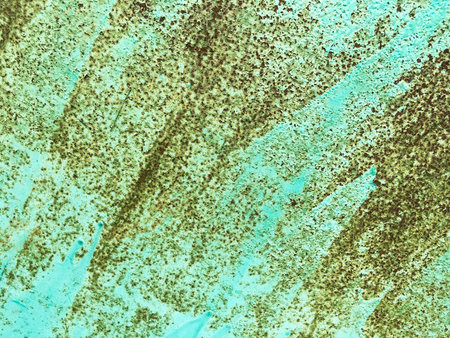 Background of an old wall covered in blue paint. Rusty metal surface. Grunge texture. Abstract...