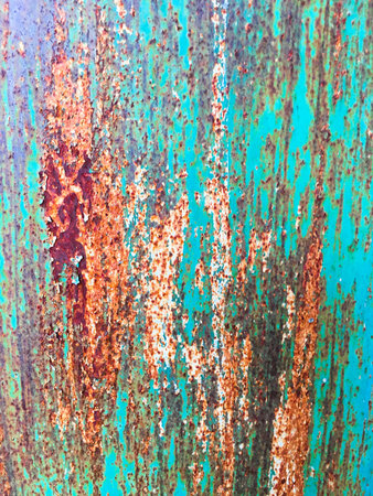 Background of an old wall covered in blue and red paint. Rusty metal surface. Grunge texture....