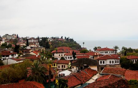 View overlooking the town. Red roofs of residential buildings and hotels. Sunny day. , Turkey, April 6, 2019.の写真素材