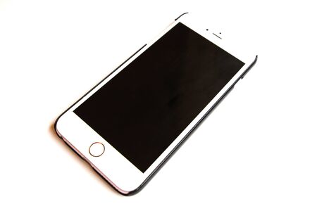 White smartphone with black screen on a white isolated background. Can be used for decoration and design.の写真素材