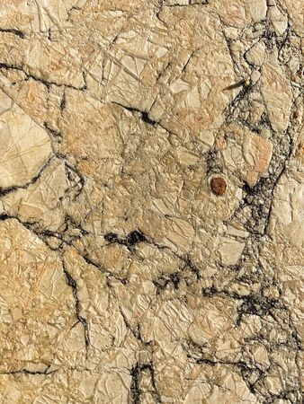 The texture of the stone with cracks. Background of natural stone.の写真素材