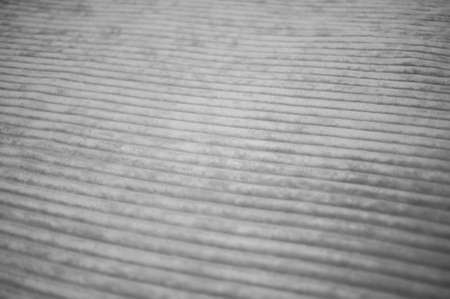 gray background with a slight waveform, perspective and shallow depth of fieldの写真素材