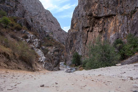 Mountain river in the middle of the gorge in the Osh region Kyrgyzstan.の写真素材