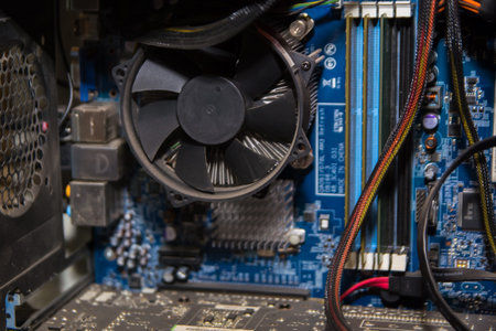 Computer internals, motherboard, RAM, cooler.