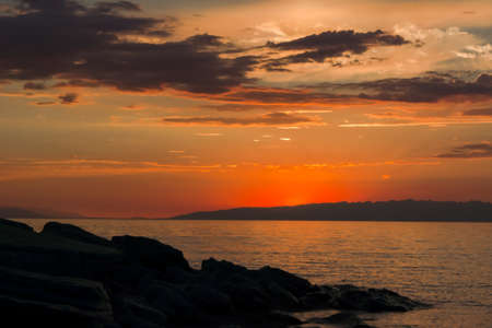 Sunset on the mountain lake Issyk Kul, Kyrgyzstanの写真素材