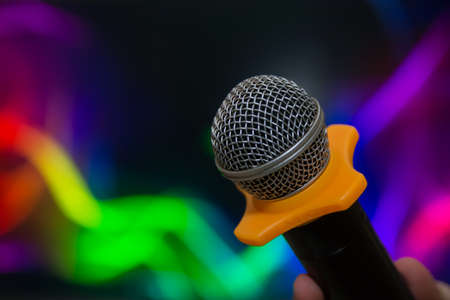 microphone on a multicolored blurred backgroundの写真素材