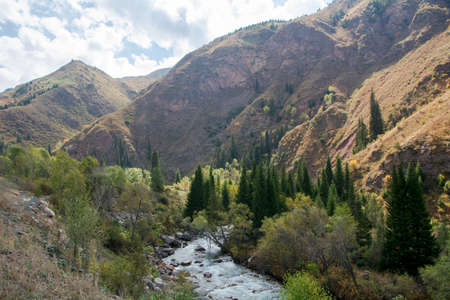 Mountain river in the middle of the gorge in the Osh region Kyrgyzstan.の写真素材