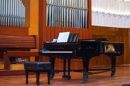 black piano on stage at the Philharmonicの写真素材