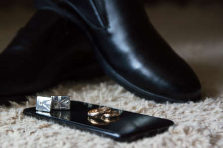 Wedding bouquet, boutonniere, wedding rings, groom's fees.の写真素材