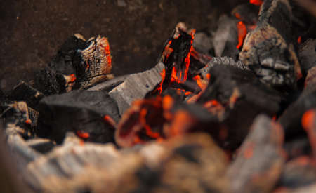 burning charcoal, fire, sparks and hall in a bonfireの写真素材