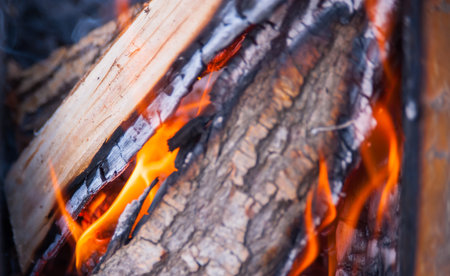 burning charcoal, fire, sparks and hall in a bonfireの写真素材