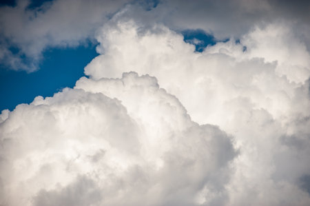 Abstract image of white clouds against a blue skyの写真素材
