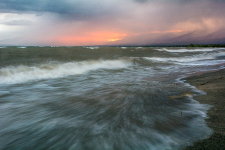 Storm waves on the Issyk-Kul lake, dirty but beautiful water.の写真素材