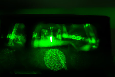 abstraction of lines and circles or balls of green color, photo of laser glowの写真素材