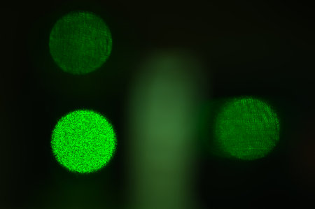 abstraction of lines and circles or balls of green color, photo of laser glowの写真素材
