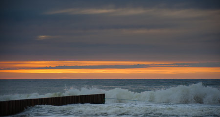 sunset and splashes of sea waves